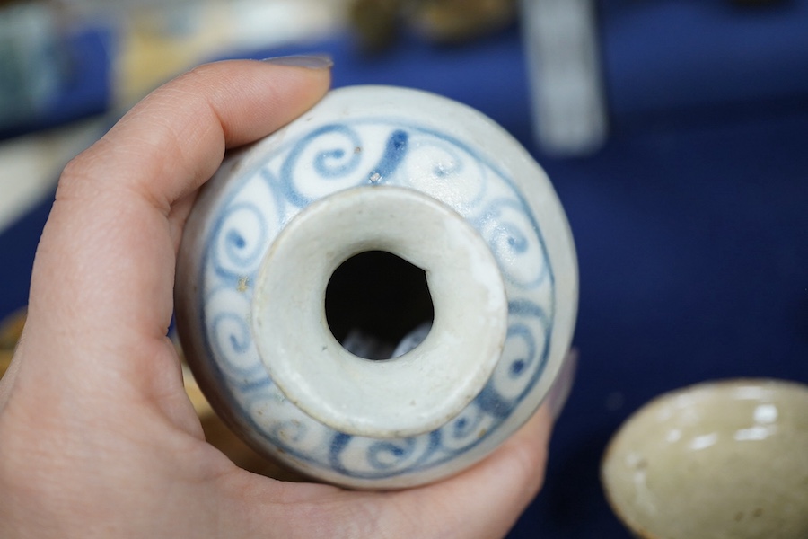 A group of Thai or Annamese miniature pottery vessels and a small blue and white vase, vase 9.5cm high. Condition - poor, fair and good